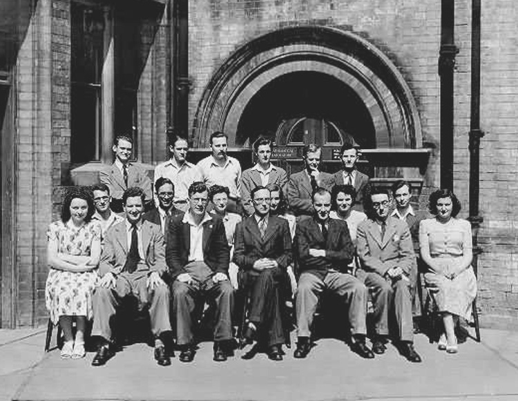 Photograph taken outside the Mathematical Laboratory at Cambridge in 1948.<br />Includes Don Willis (back row - extreme left), Ernest Lenaerts (2nd row - 2nd from left), John Bennett, Eric Mutch, Bill Renwick, Maurice Wilkes (centre front), David Wheeler and Ben Noble (front row - 3rd from left)