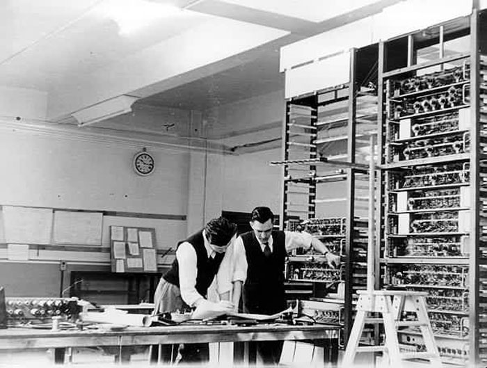 Gordon Gibbs and Ray Shaw  look at a circuit diagram in February 1950.